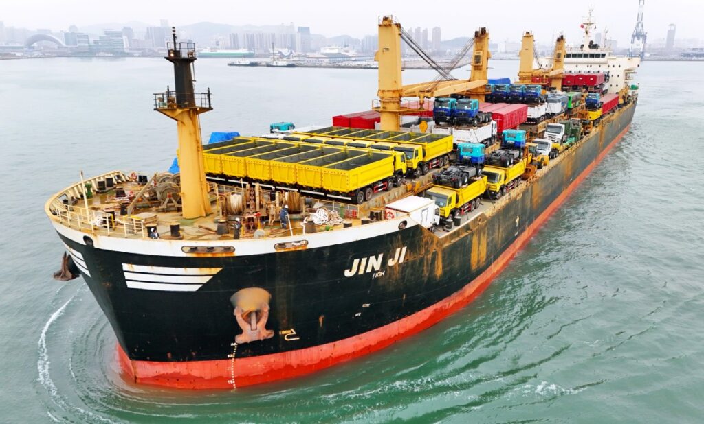 A cargo ship loaded with export-bound cars sets sail for Cote d’Ivoire at Yantai Port, Shandong province. TANG KE/FOR CHINA DAILY