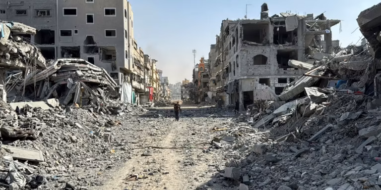 A Palestinian walks amid the ruins of the Kamal-Adwan hospital in Jabaliya, northern Gaza Strip, on October 26, 2024. STRINGER / REUTERS