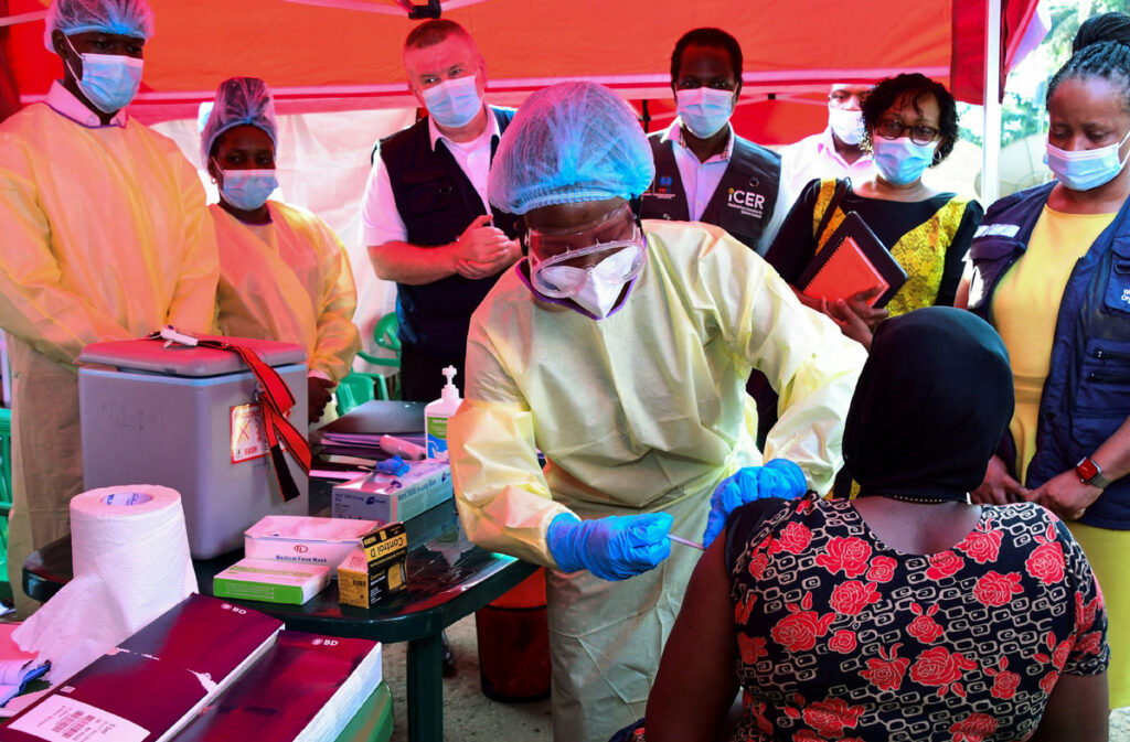 PRESIDENT RAMAPHOSA'S REMARKS ON THE EBOLA OUTBREAK IN DRC AND UGANDA - A Ugandan doctor vaccinates the contact of a patient who tested positive during the launch of the vaccination for the Sudan strain of the Ebola virus with a trial vaccine at the Mulago Guest House (Isolation centre) in Kampala, Uganda, Feb 3, 2025. [Photo/Agencies / China Daily]