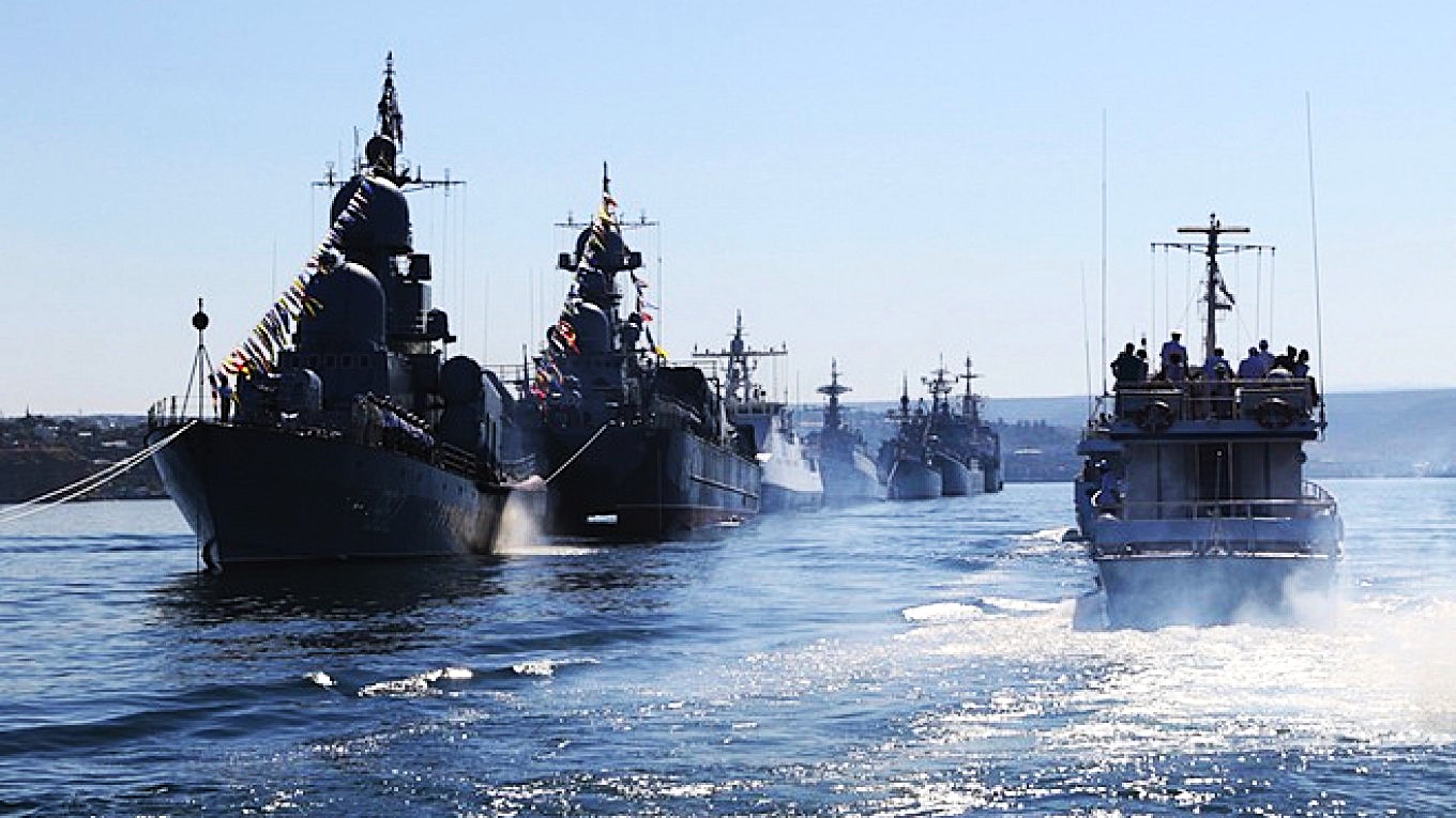 Russian warships are seen during a rehearsal for the Navy Day parade in Sevastopol, Crimea, July 24, 2015. - moscow times