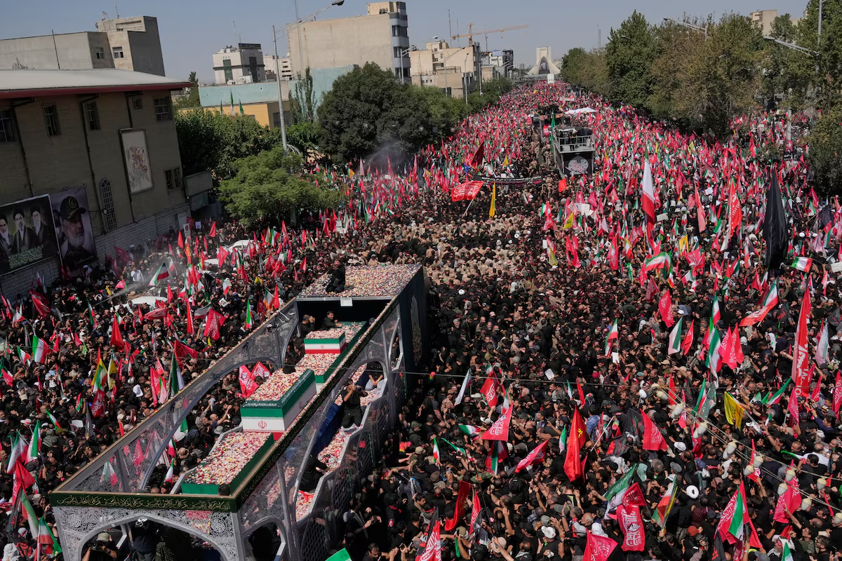 MILLIONS, FROM MANY NATIONS, ATTEND IRANIAN LEADER KHAMENEI'S FUNERAL - image: The truck carrying the coffins of the slain Iranian Supreme Leader Ayatollah Ali Khamenei and members of his family makes its way through mourners during the funeral procession toward Azadi Tower in Tehran on Monday. Vahid Salemi/The Associated Press